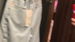 Hot MILF masturbates in the fitting room of the store
